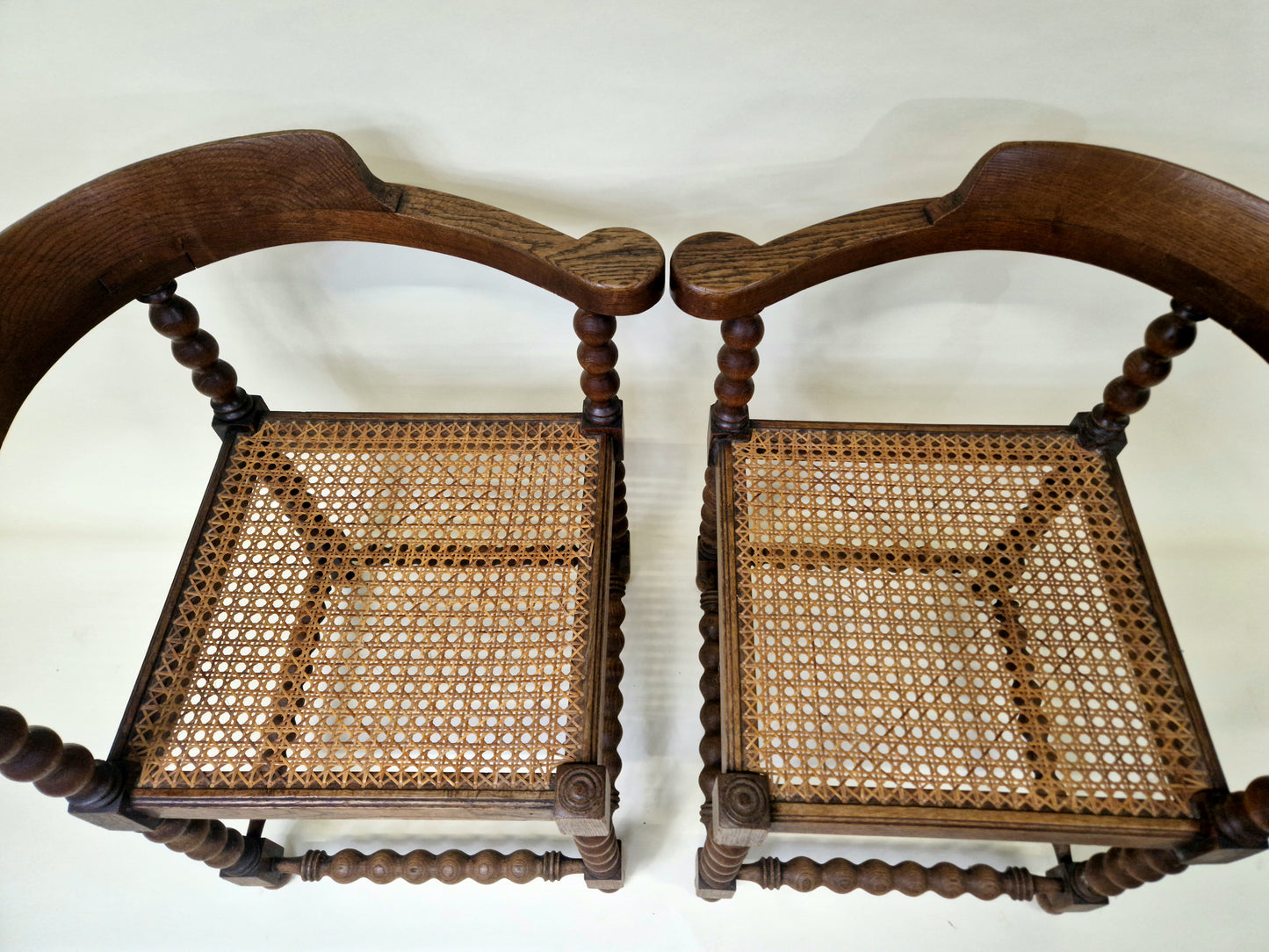 Set of 2 Antique French Bobbin Corner Chairs from the 1920s with rattan seat