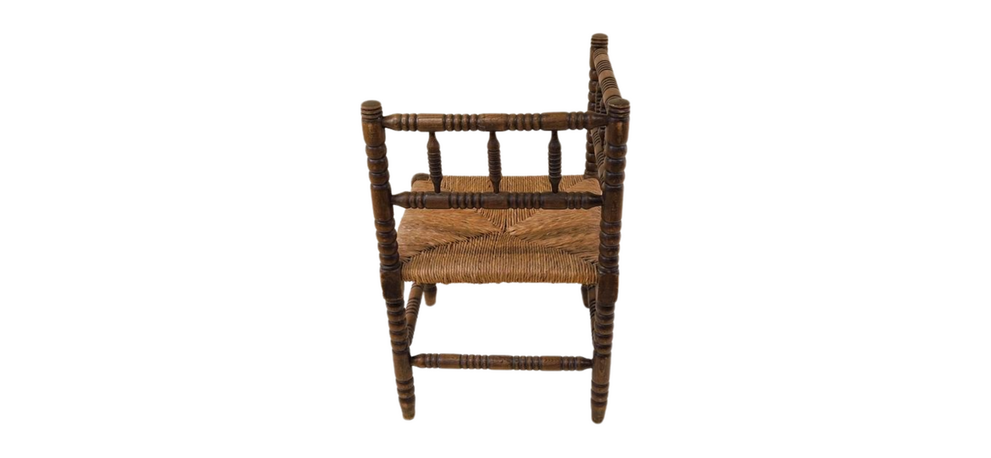 Antique French Bobbin oak wood corner chair with woven wicker seat